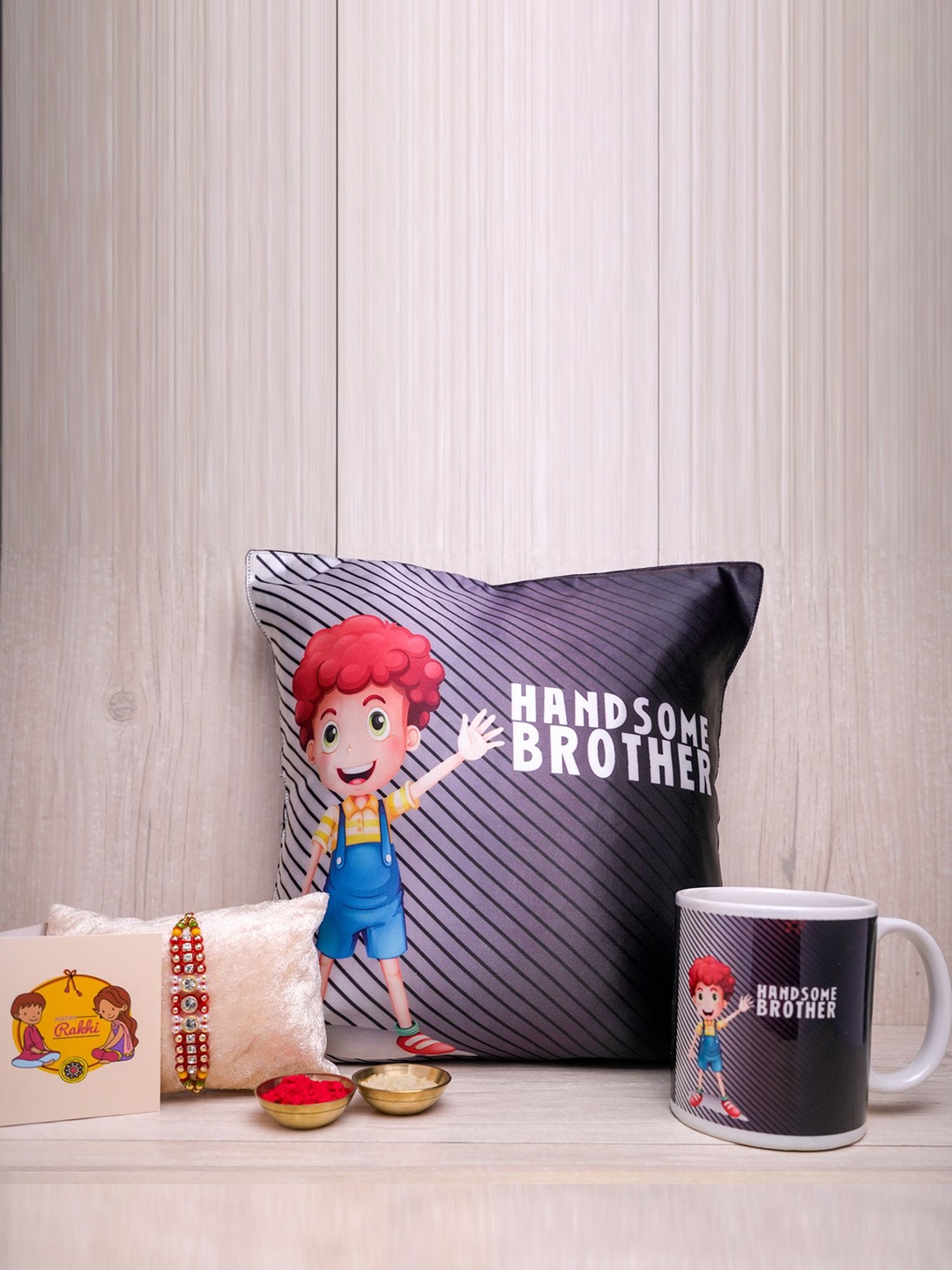 

Phirki Studio Set of 3 Beaded Rakhi With Cushion & Mug With Greeting Card & Roli Chawal, Grey