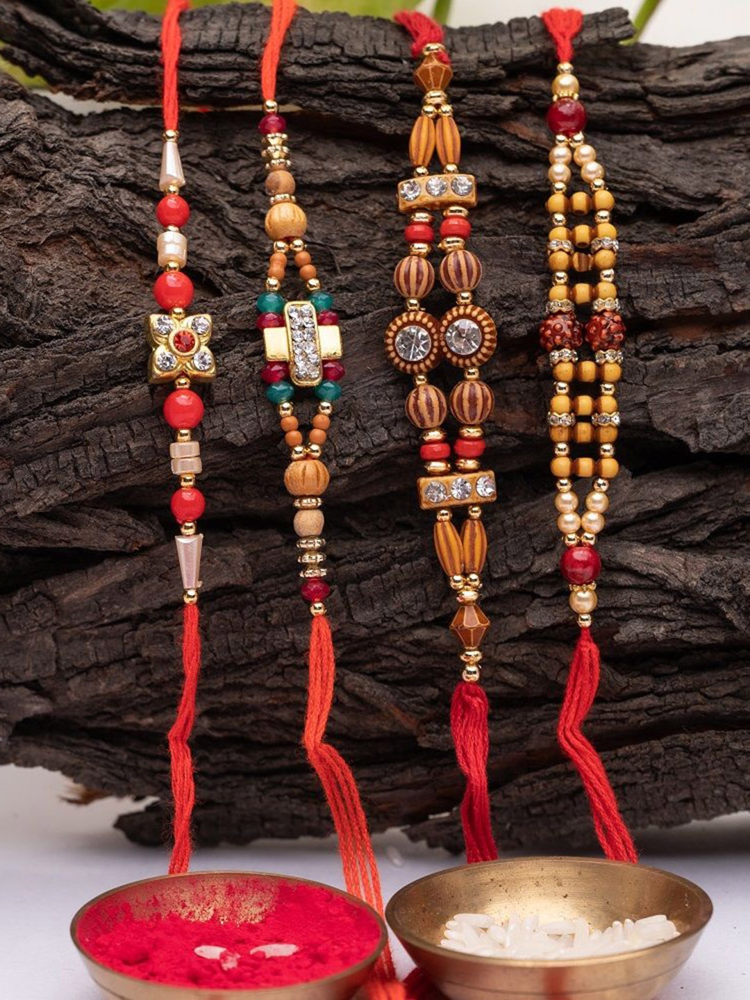 

Phirki Studio Set Of 4 Stone-Studded & Beaded Rakhi With Roli Rice, Red