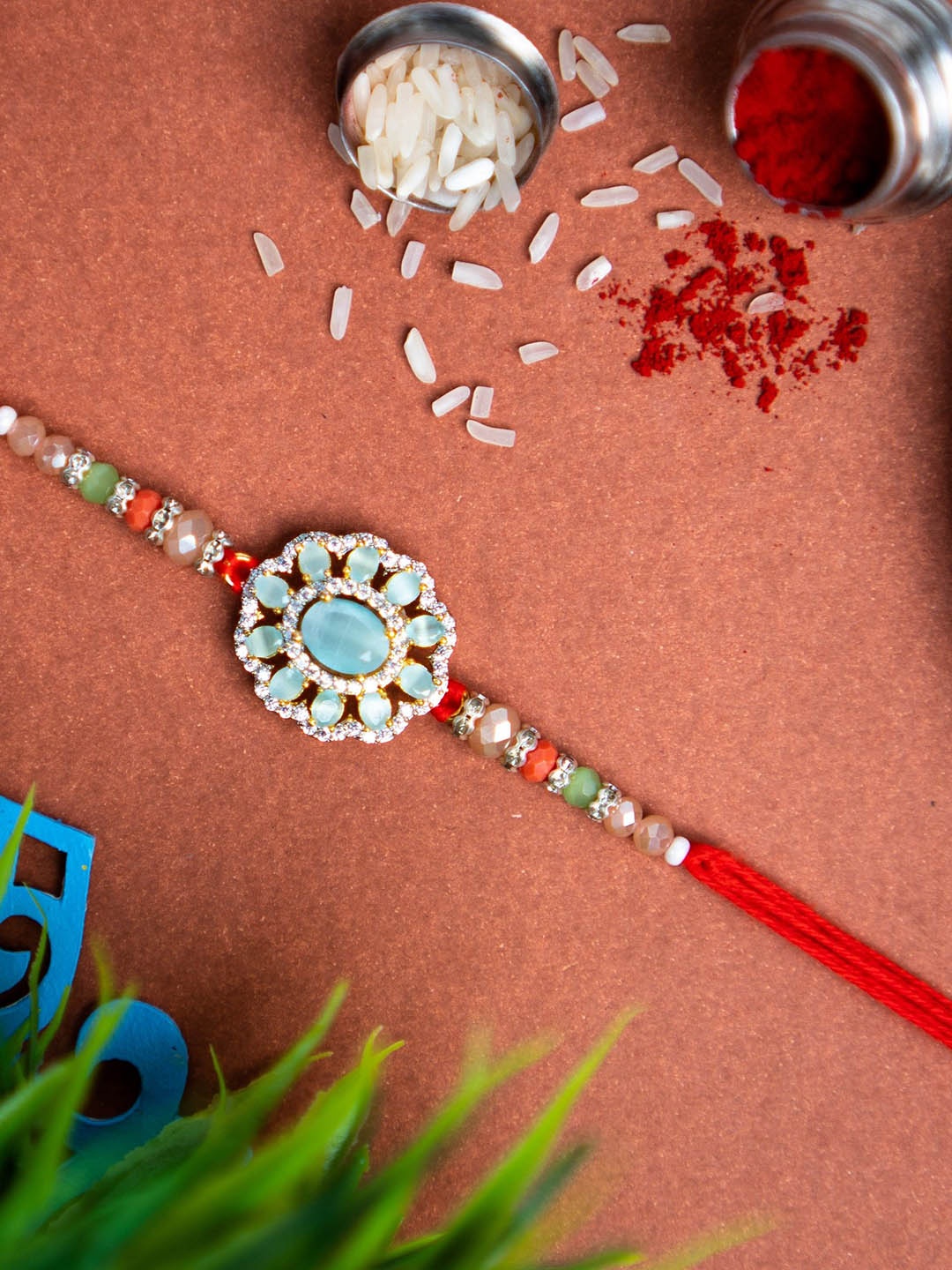 

Phirki Studio Stone Studded & Beaded Rakhi With Roli Chawal, Red