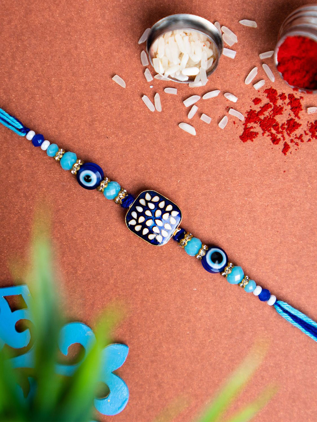 

Phirki Studio Stone Studded & Evil Eye Beaded Rakhi With Roli Chawal, Blue