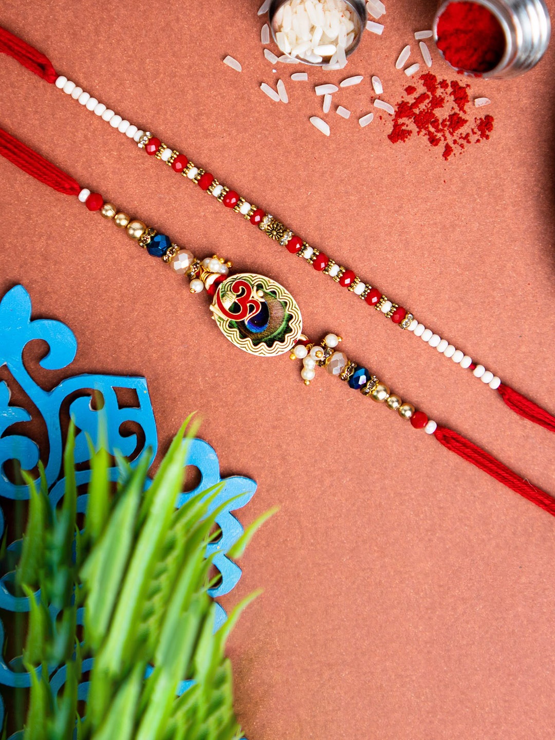 

Phirki Studio Set Of 2 Stone Studded & Beaded Rakhi With Roli Chawal, Red