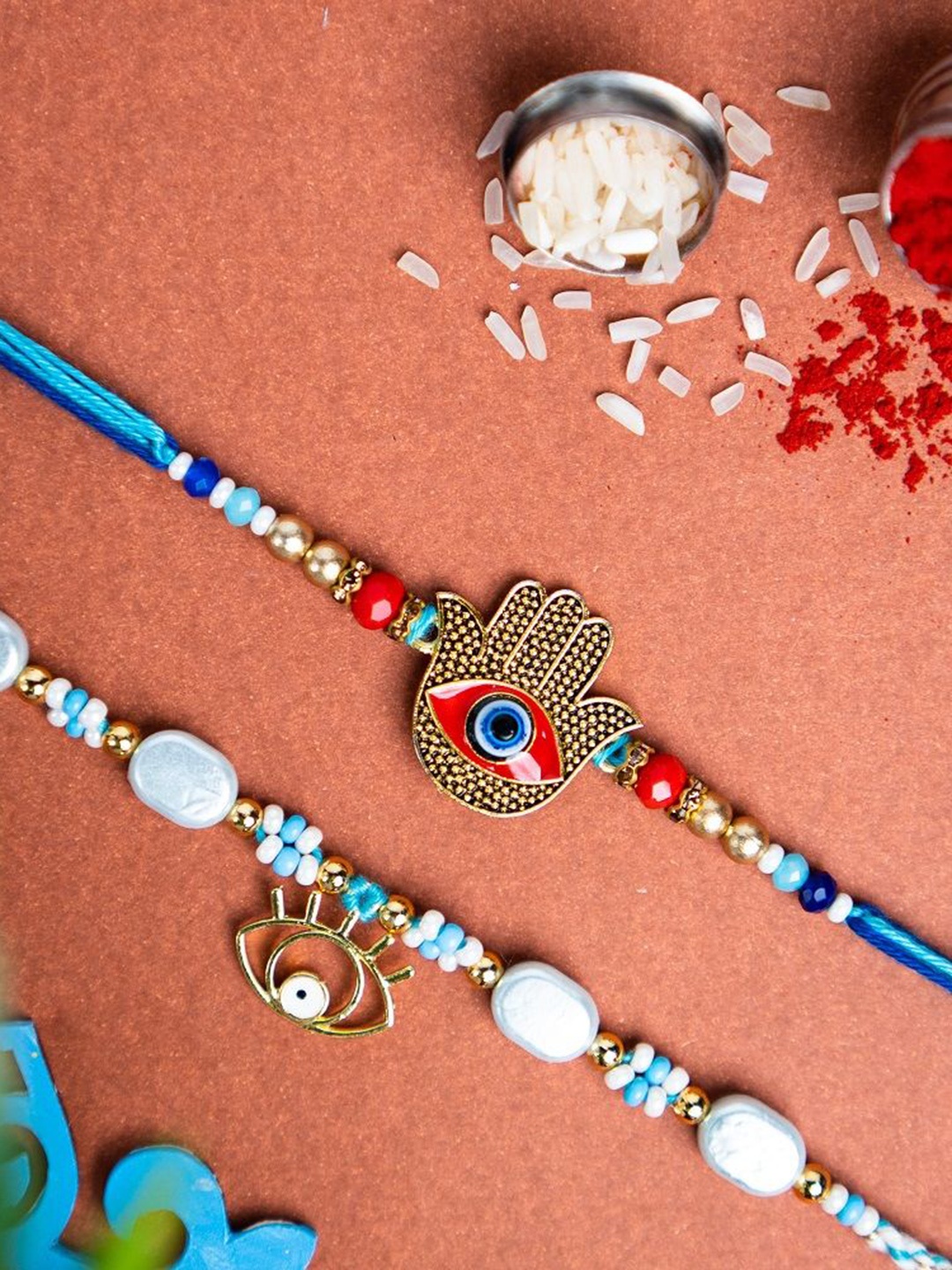 

Phirki Studio Set of 2 Beaded Thread Rakhis with Roli Chawal, Blue