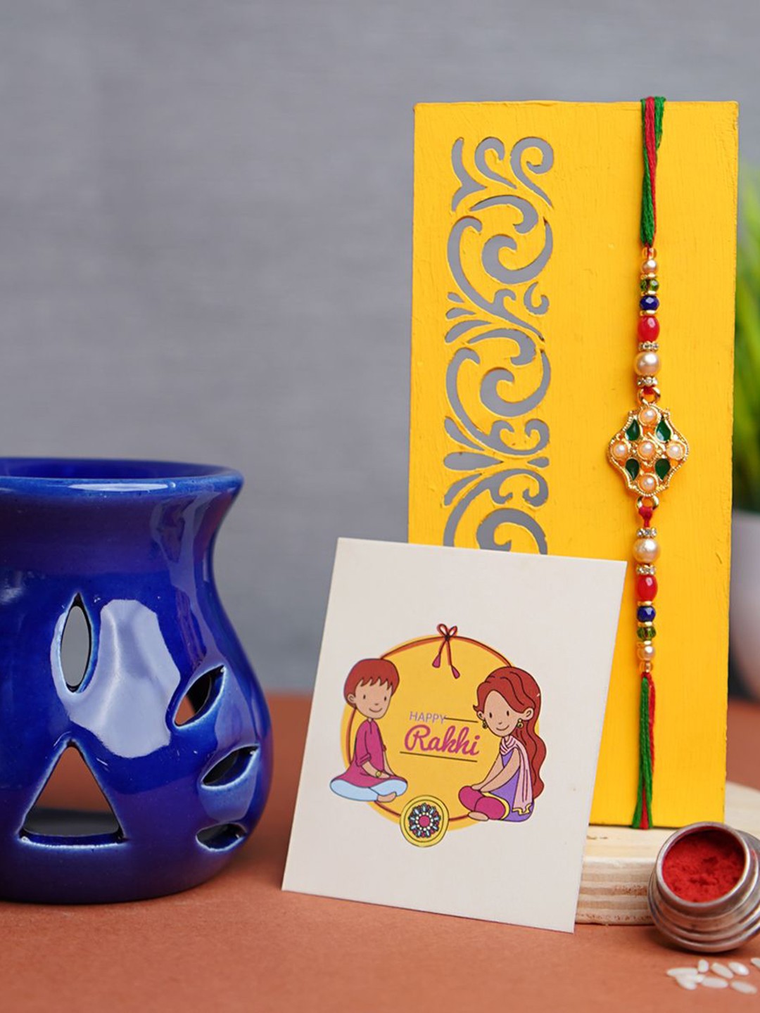 

Phirki Studio Set Of 2 Beaded Rakhi With Diffuser With Greeting Card & Roli Chawal, Blue