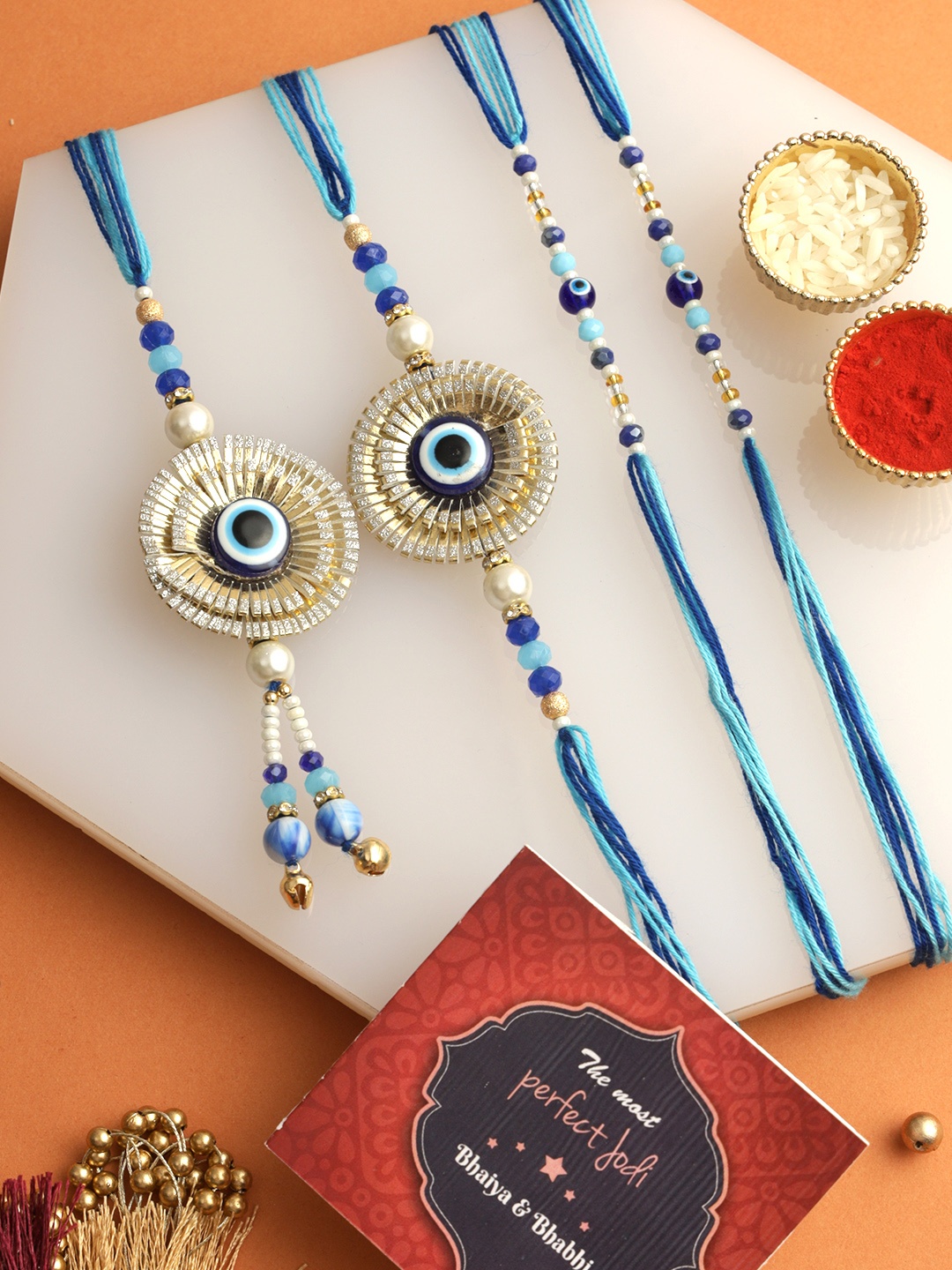 

Tied Ribbons Set of 4 Bhaiya Bhabhi Kids Rakhi, Card & Roli Chawal Set, Blue