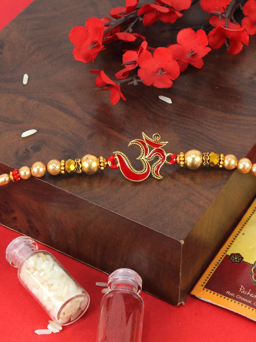 

TIED RIBBONS Om Rakhi With Card & Roli Chawal, Red