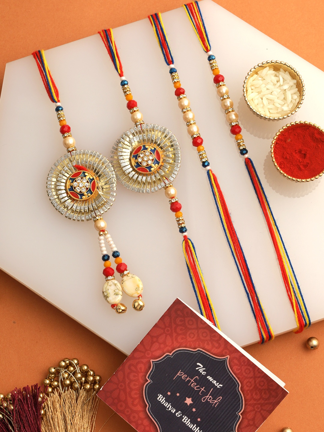 

TIED RIBBONS Kids Set Of 4 Bhaiya Bhabhi Thread Rakhi Mini Card And Roli Chawal, Orange