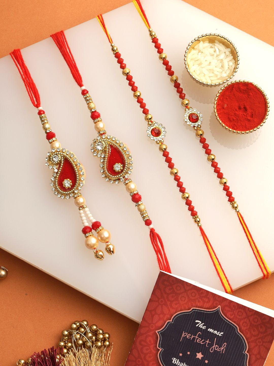 

Tied Ribbons Set of 4 Bhaiya Bhabhi Kids Rakhi, Card & Roli Chawal Set, Red