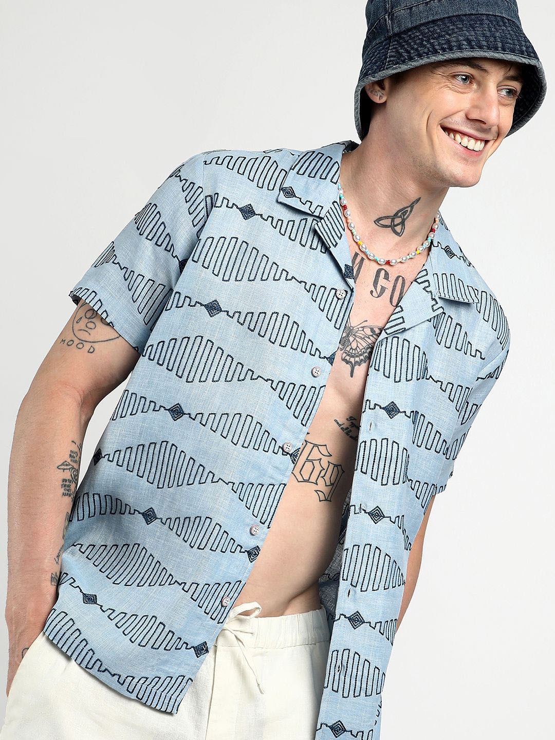 

Campus Sutra Men Comfort Cuban Collar Geometric Embroidered Casual Shirt, Blue