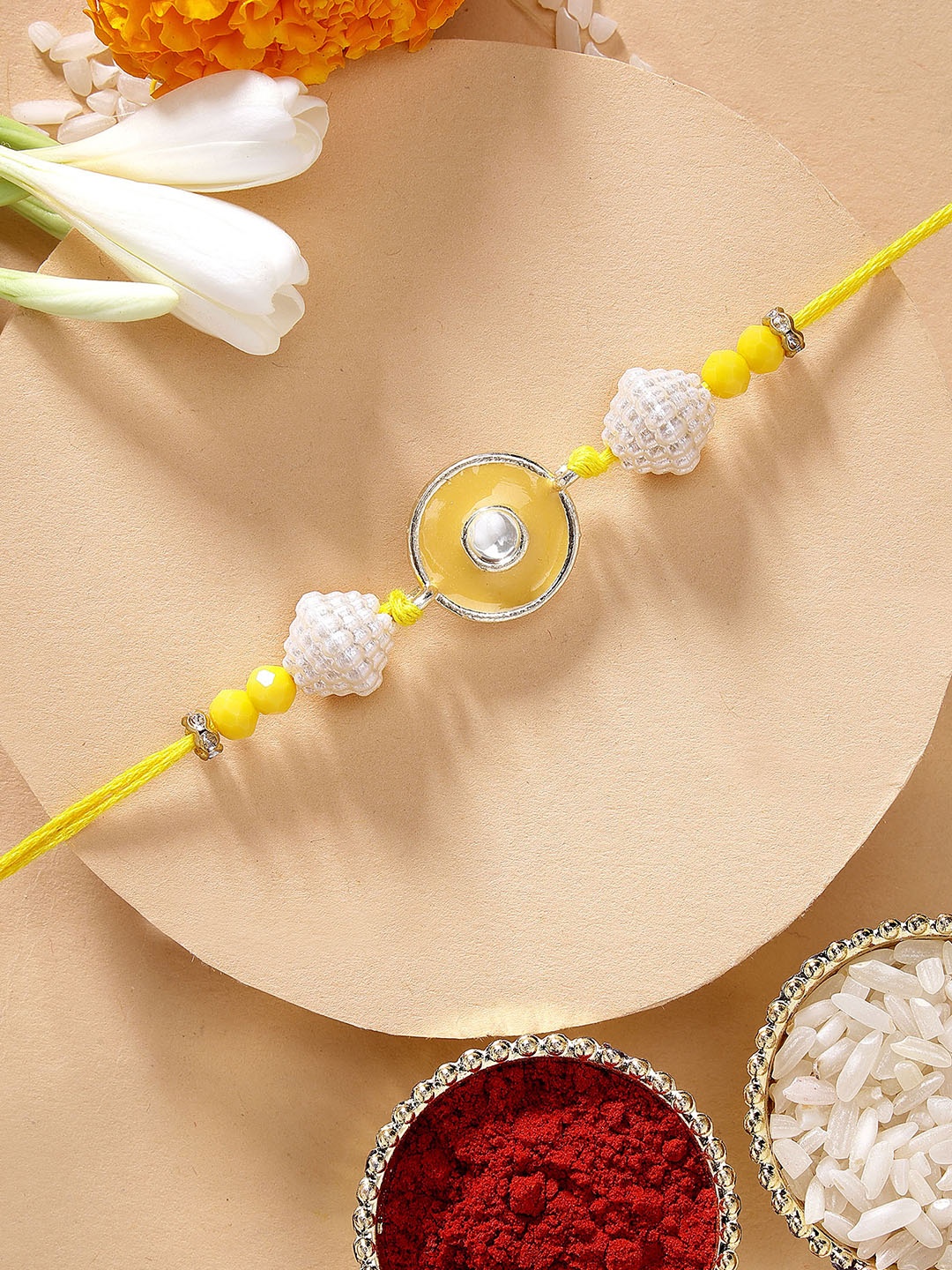 

KARATCART Yellow Meena Evil Eye Design Kundan Rakhi with Roli Chawal