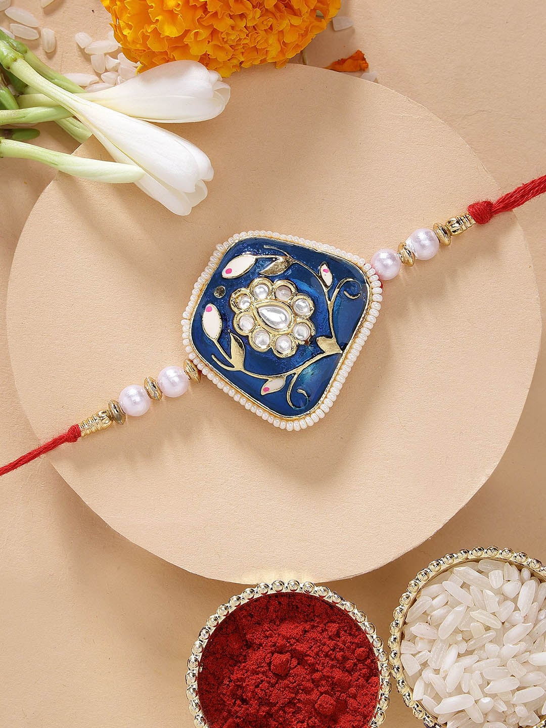 

KARATCART Blue Meenakari Floral Design Rakhi with Roli Chawal