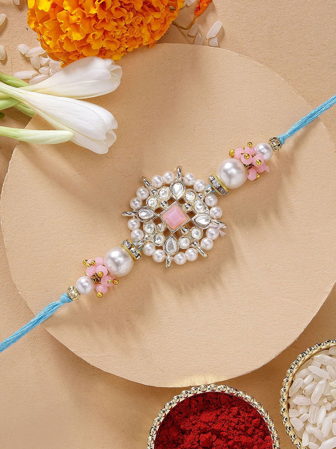 

KARATCART Floral Design Pink Stone Kundan Rakhi with Roli Chawal, Blue