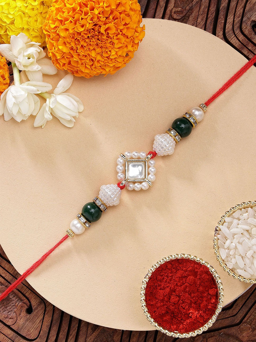

KARATCART Gold Plated Green Beads Kundan Rakhi with Roli & Chawal, Red