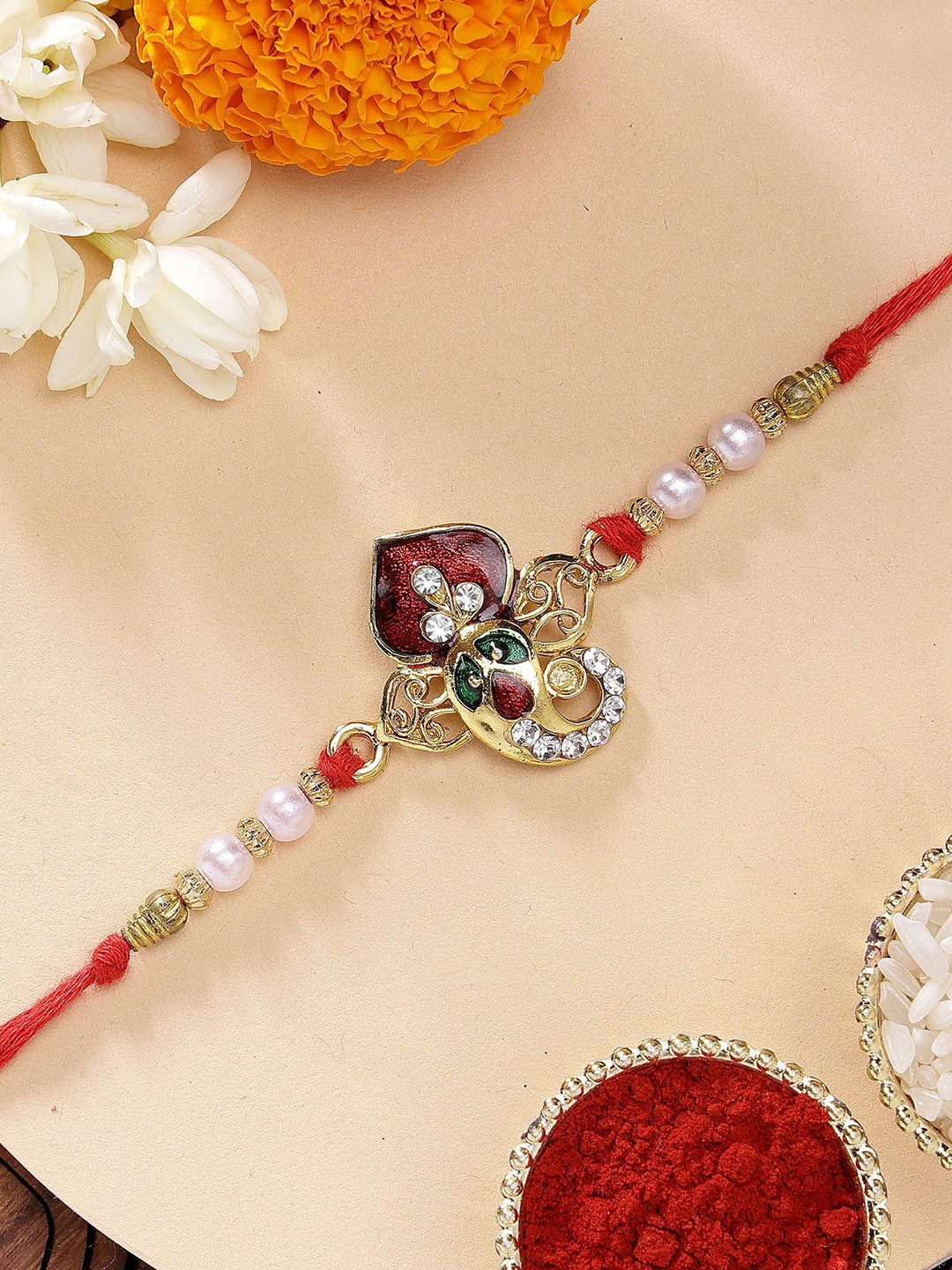 

KARATCART Lord Ganesha Design Meenakari Kundan Rakhi with Roli Chawal, Red