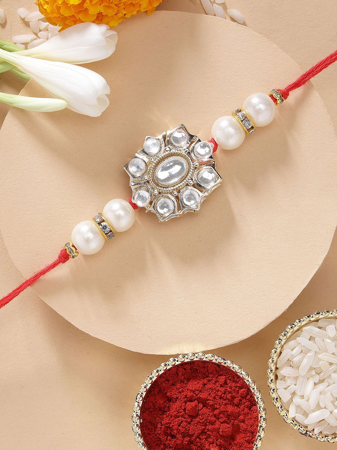 

KARATCART Floral Design Pearl & Kundan Rakhi with Roli & Chawal, Gold