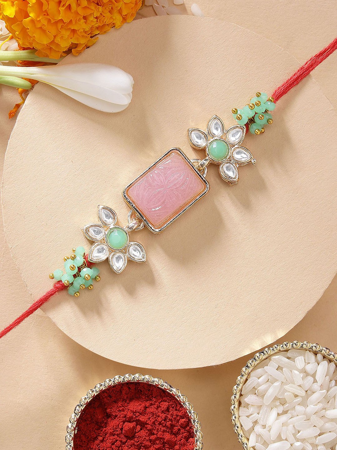 

KARATCART Pink Carved Stone & Lime Green Crystal Kundan Rakhi with Roli Chawal