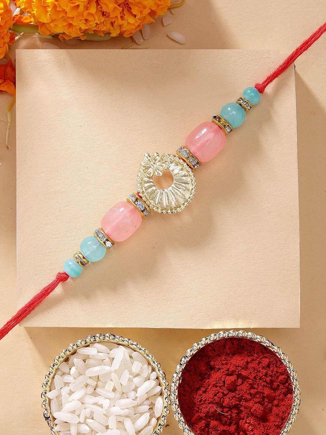 

KARATCART Pink & Blue Beads Kundan Rakhi with Roli & Chawal, Red