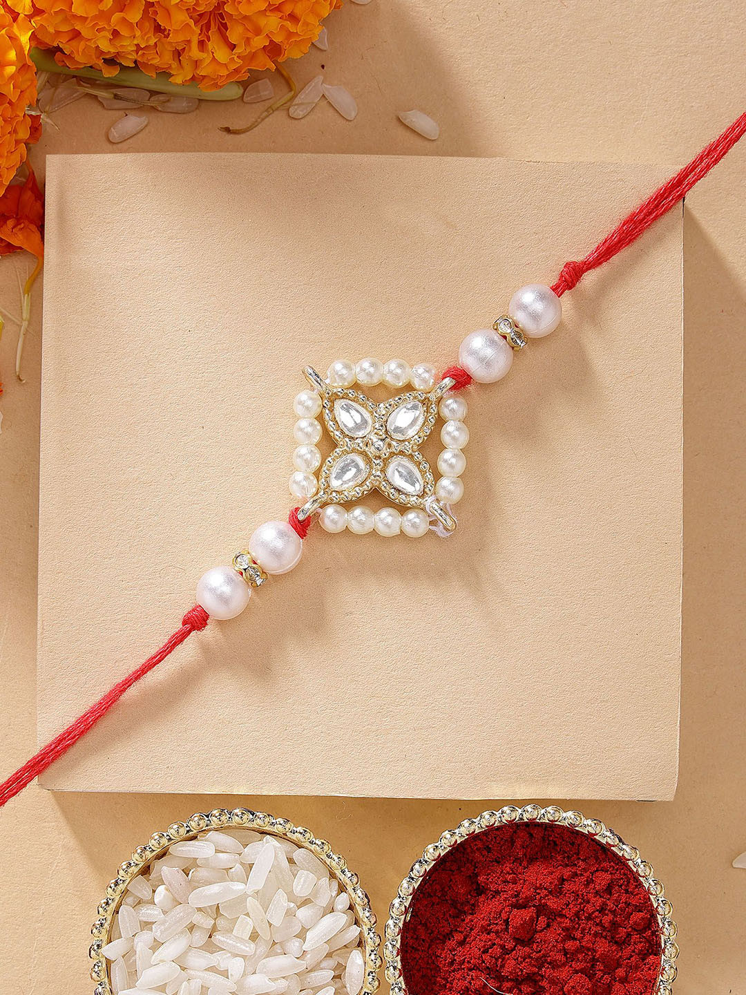 

KARATCART Weight Floral Design Kundan Rakhi with Roli Chawal, Gold