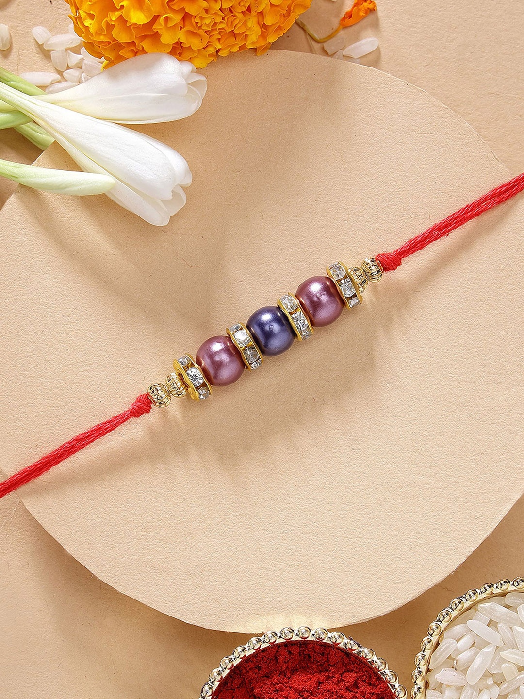

KARATCART Weight Blue & Purple Pearl Rakhi with Roli & Chawal