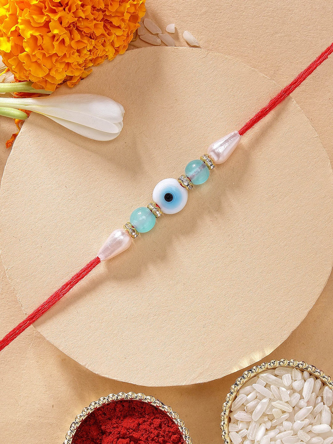 

KARATCART Blue Beads Evil Eye Rakhi with Roli & Chawal