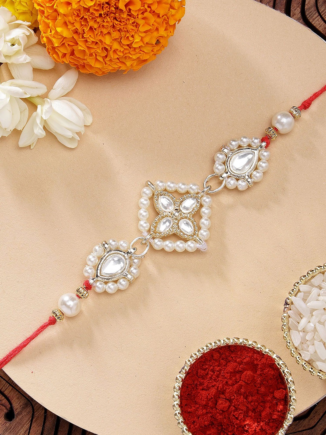 

KARATCART Gold Plated Floral Design Kundan Rakhi with Roli Chawal, White