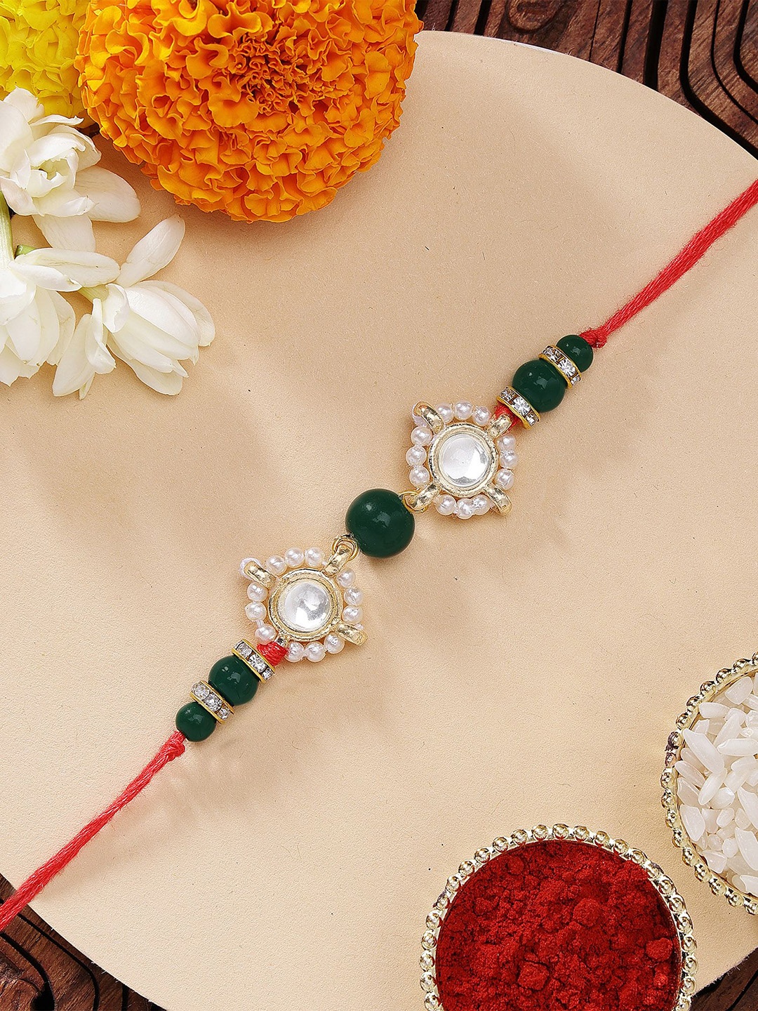 

KARATCART Fashionable Gold Plated Green Beads Kundan Rakhi with Roli & Chawal, Red