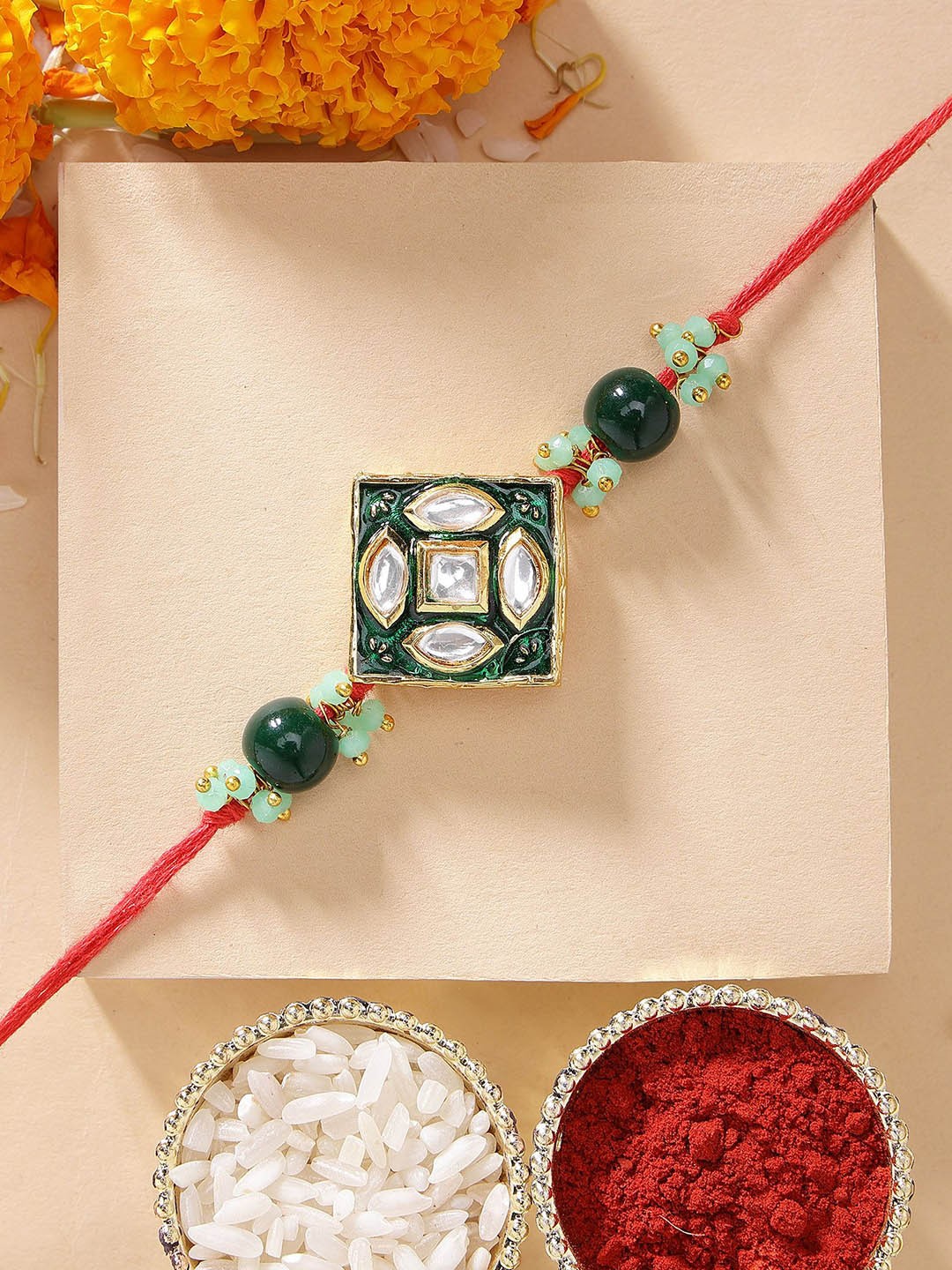

KARATCART Green Meena Floral Design Kundan Rakhi with Roli & Chawal