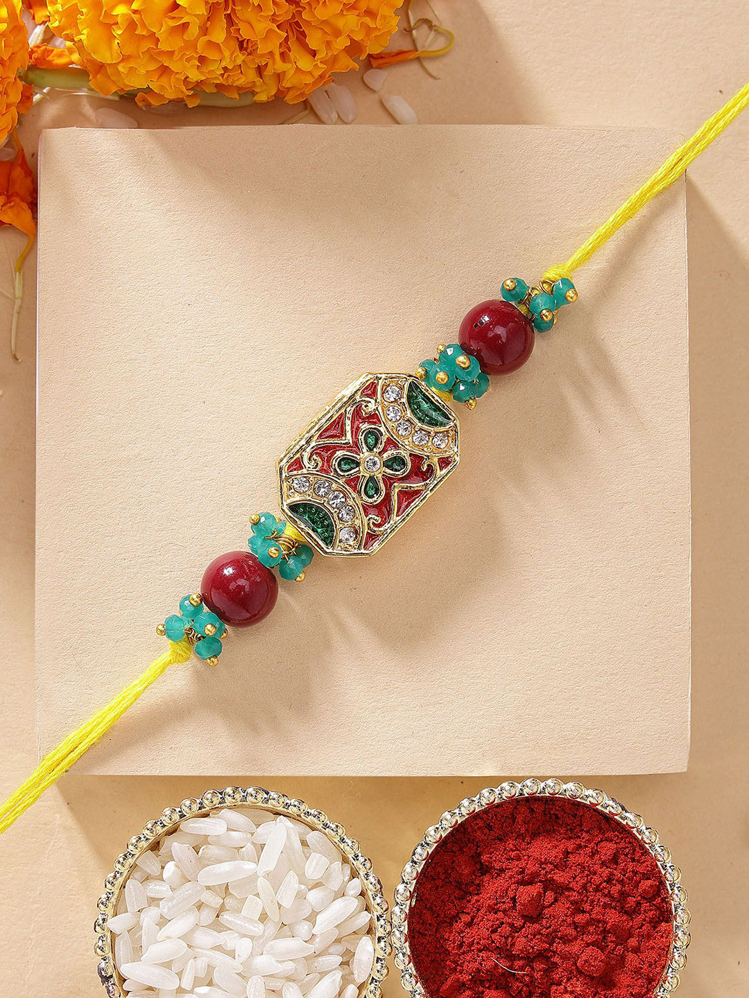 

KARATCART Red & Green Meena Crystal Studded Rakhi with Roli & Chawal, Gold