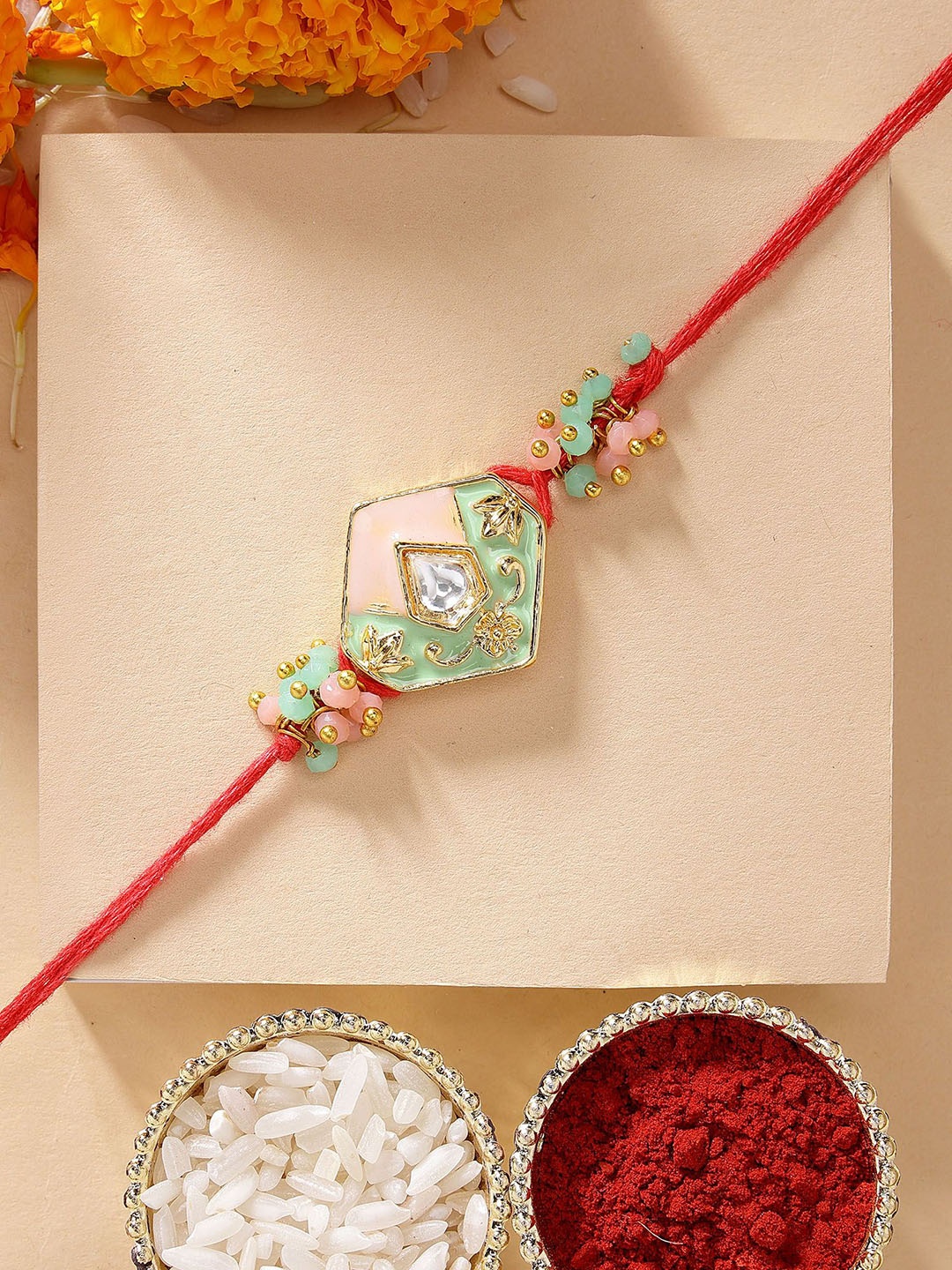 

KARATCART Peach & Lime Green Meena Kundan Rakhi with Roli & Chawal, Red