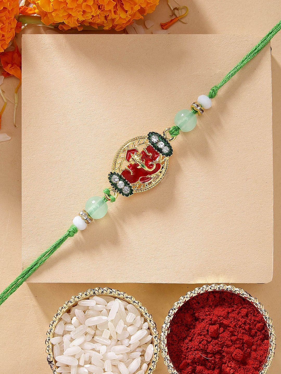 

KARATCART Lord Ganesha Design Meenakari Kundan Rakhi with Roli Chawal, Green