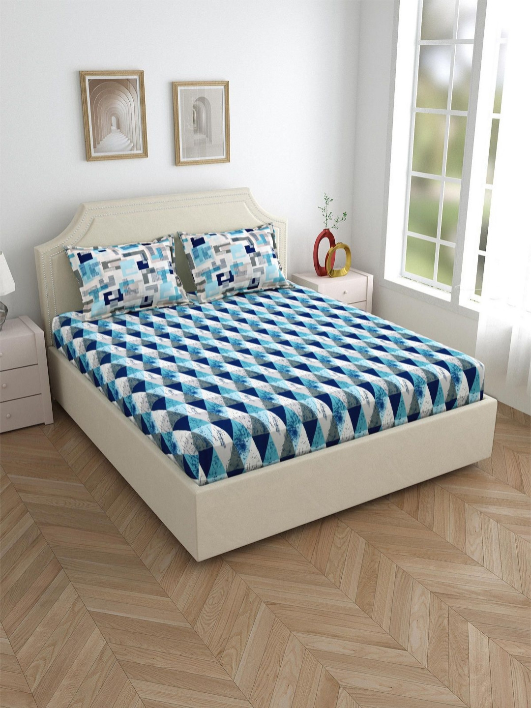 

Salona Bichona Blue & White Geometric 120 TC King Bedsheet with 2 Pillow Covers