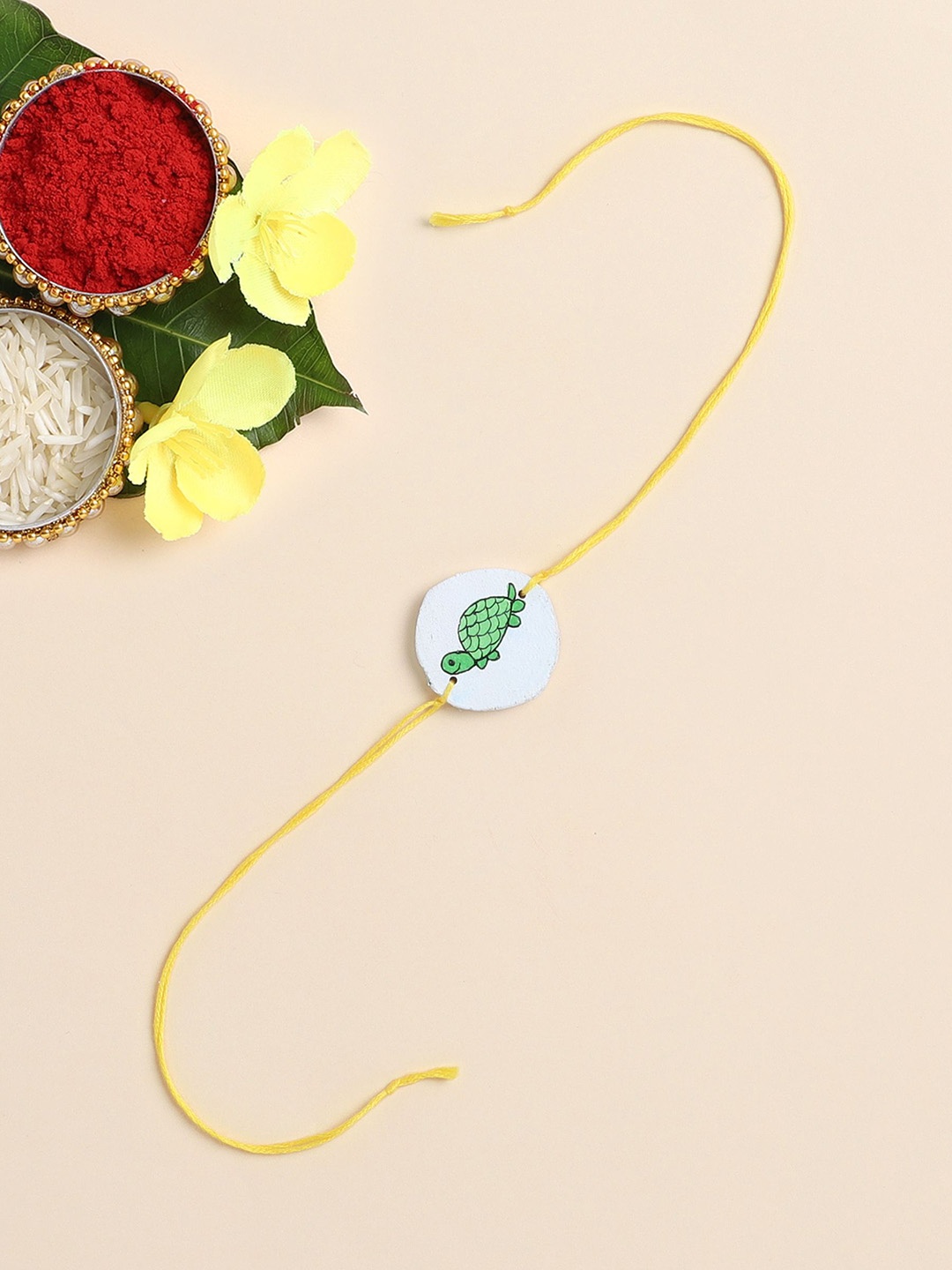 

The Magic Wand Tortoise Printed Thread Rakhi, White