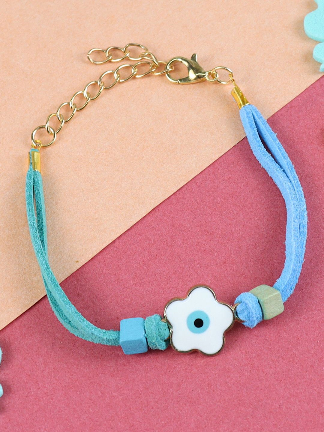 

Asthetika Floral Evil Eye Charm Bracelet Rakhi with Roli Chawal, Blue