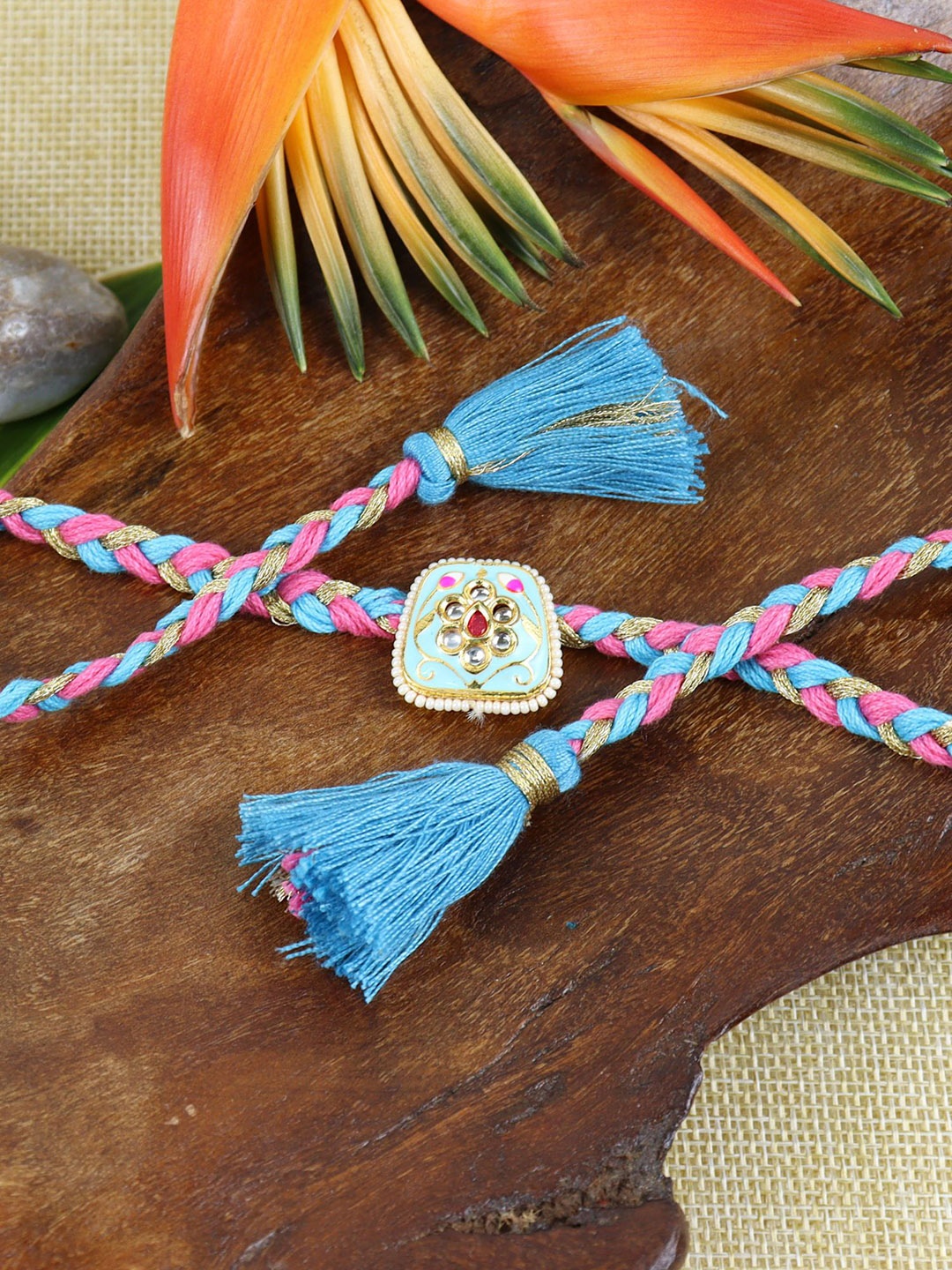 

Asthetika Kundan Stone Studded Braided Fancy Tassel Rakhi with Roli Chawal, Blue