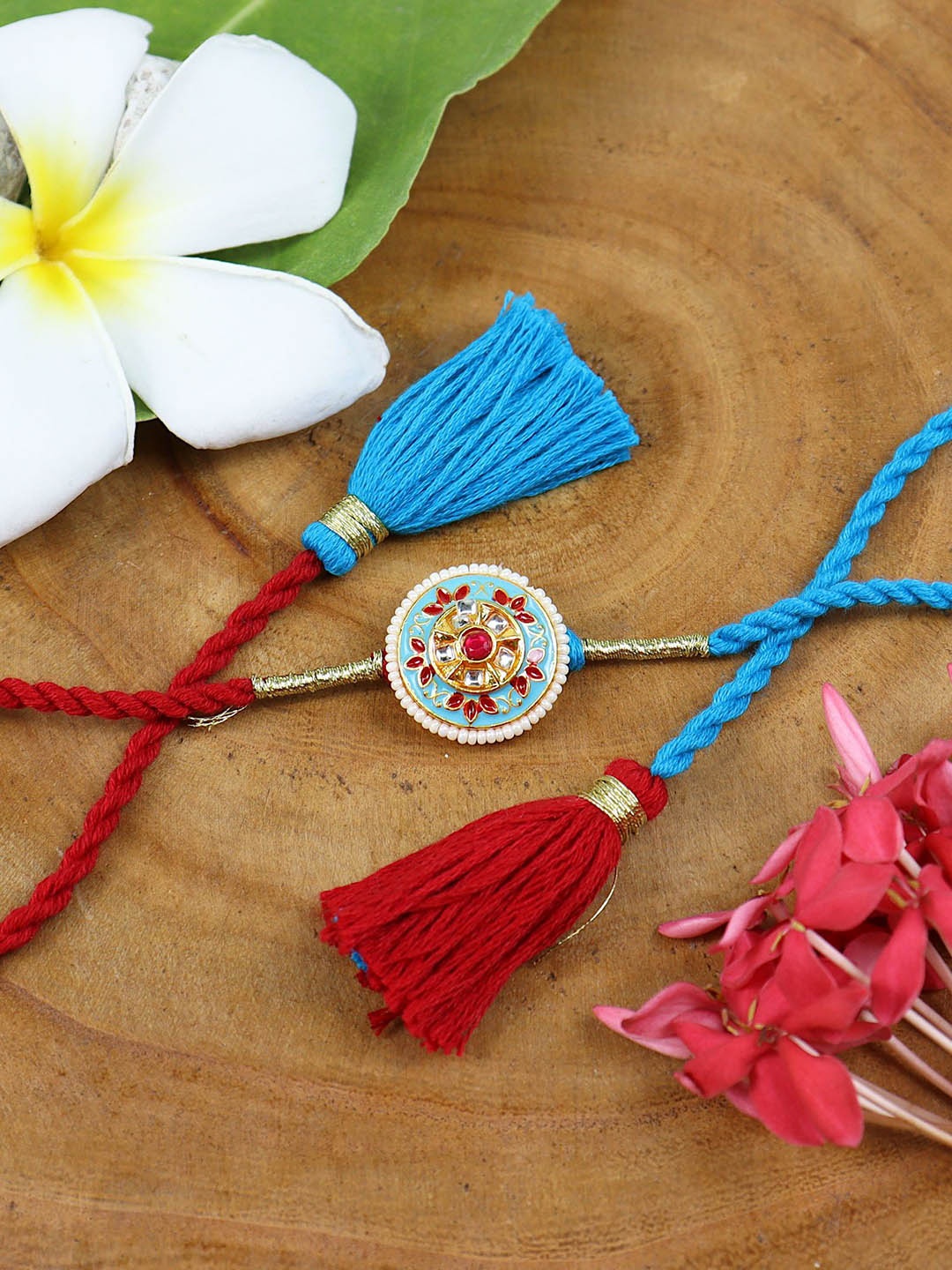 

Asthetika Kundan Stone Studded Fancy Tassel Rakhi with Roli Chawal, Red