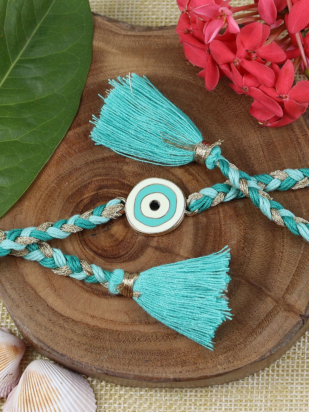 

Asthetika Evil Eye Braided Fancy Tassel Rakhi With Roli Chawal, Blue