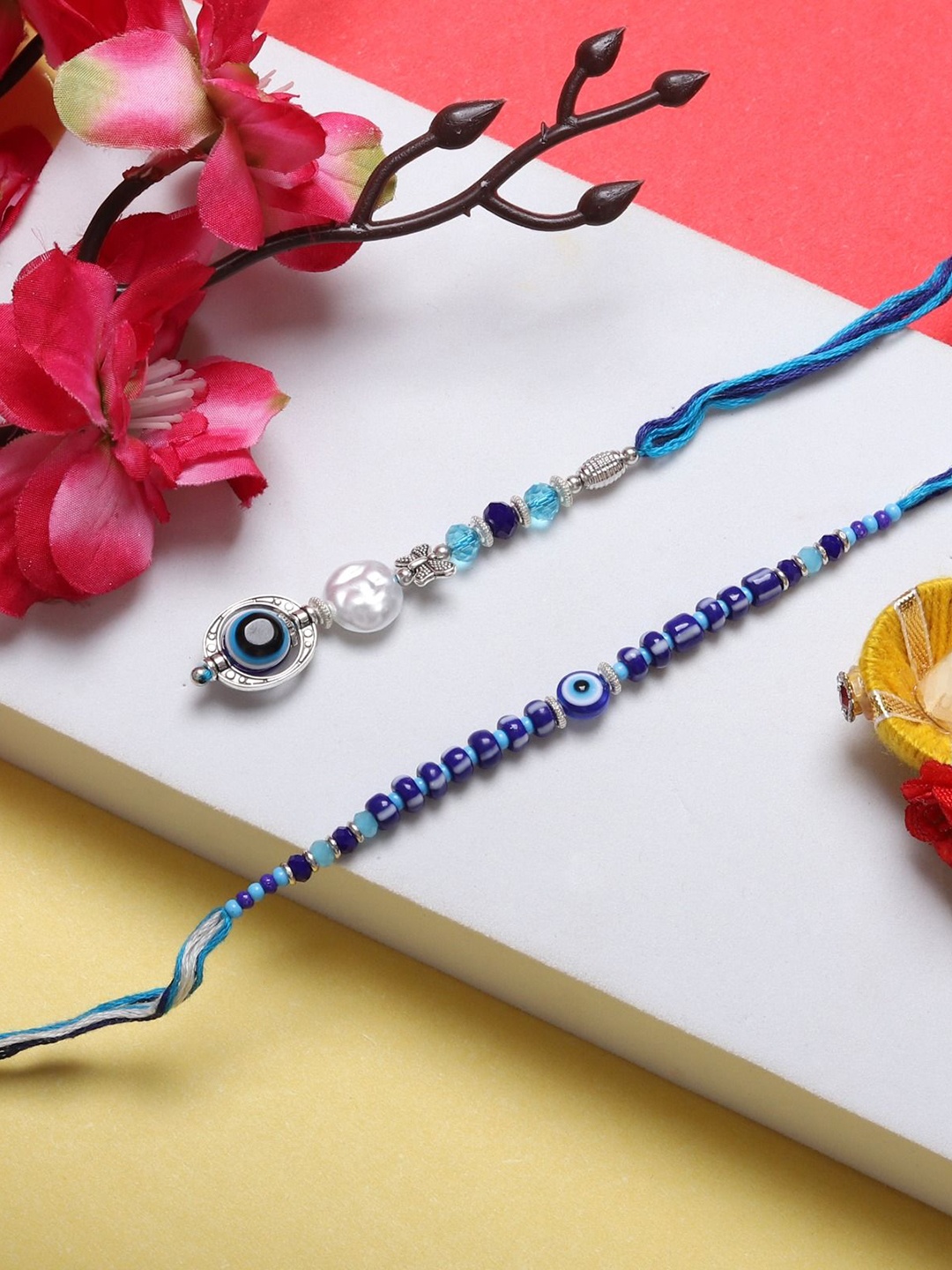 

Mali Fionna Set Of 2 Beaded Thread Rakhis, Blue