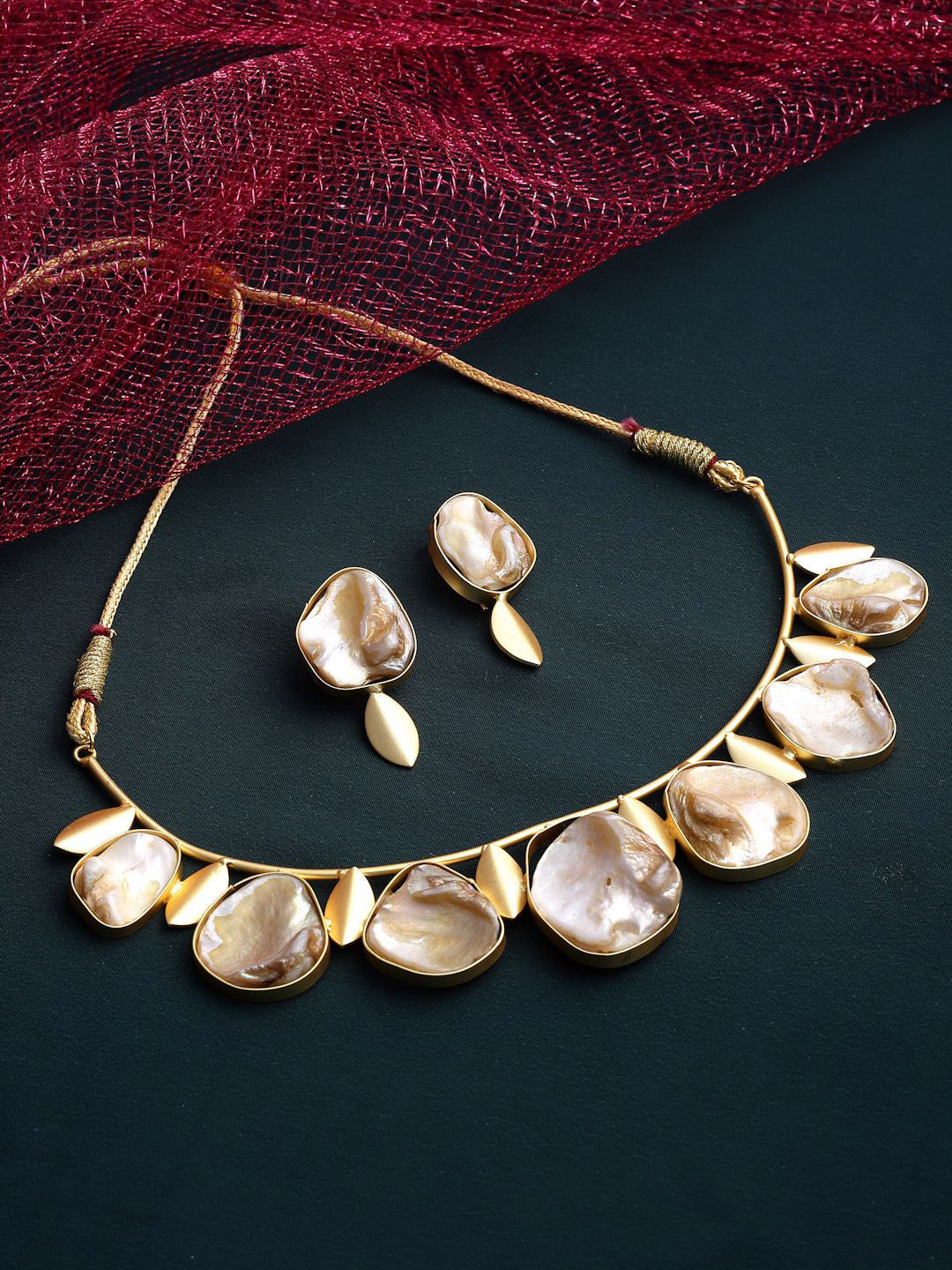 

Sanjog Mother Of Doozy Pearl Gold-Plated Stone-Studded Brass Choker Jewellery Set