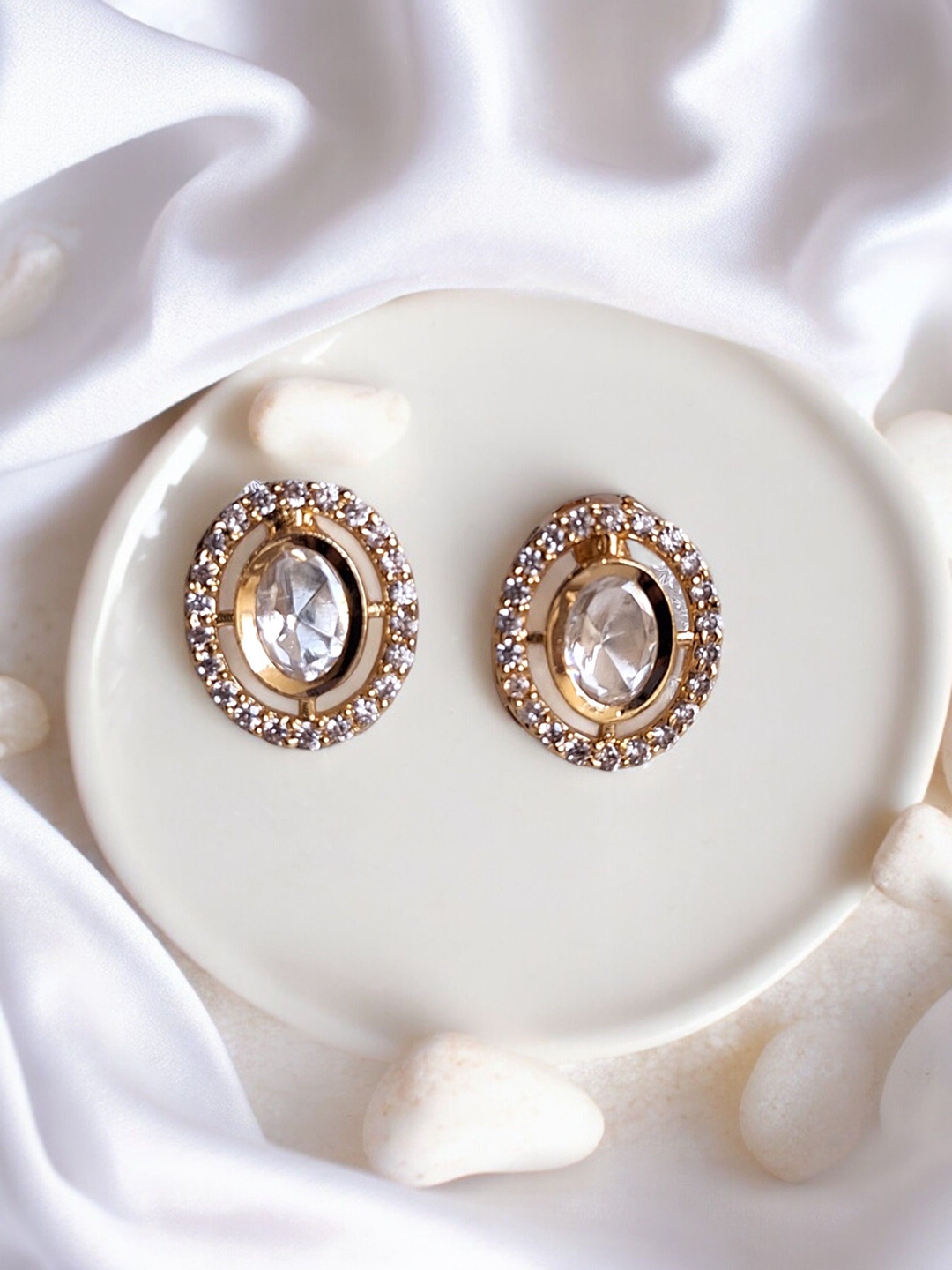 

XAGO Gold-Plated Brass Oval Shaped Kundan Studs Earrings