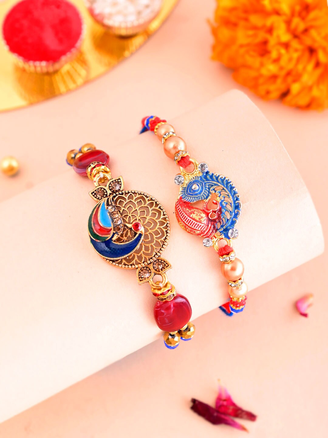 

Aapno Rajasthan Set Of 2 Stone Studded & Beaded Rakhis With Roli Chawal & Greetings Card, Gold