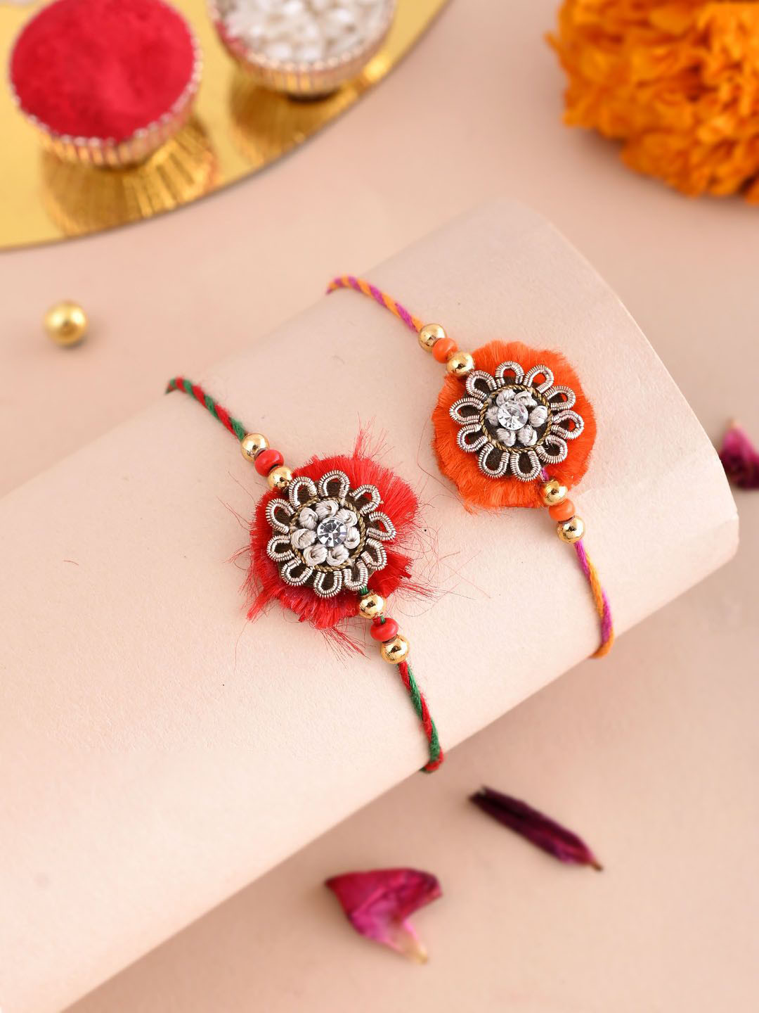 

Aapno Rajasthan Set Of 2 Floral Thread Rakhi With Roli Chawal & Greeting Card, Gold