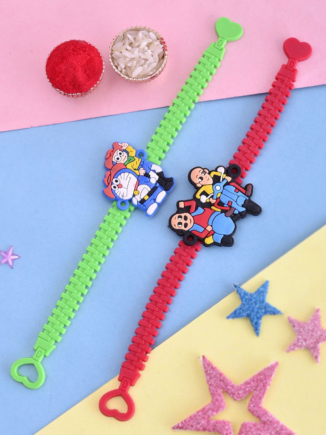 

Aapno Rajasthan Set Of 2 Motu Patlu & Doraemon Rakhis With Roli Chawal, Blue