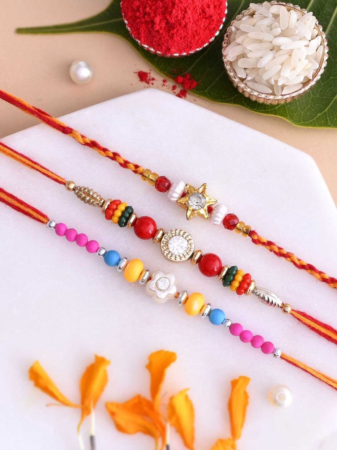 

Aapno Rajasthan Set of 3 Beaded Rakhi with Roli Chawal & Greeting Card, Gold