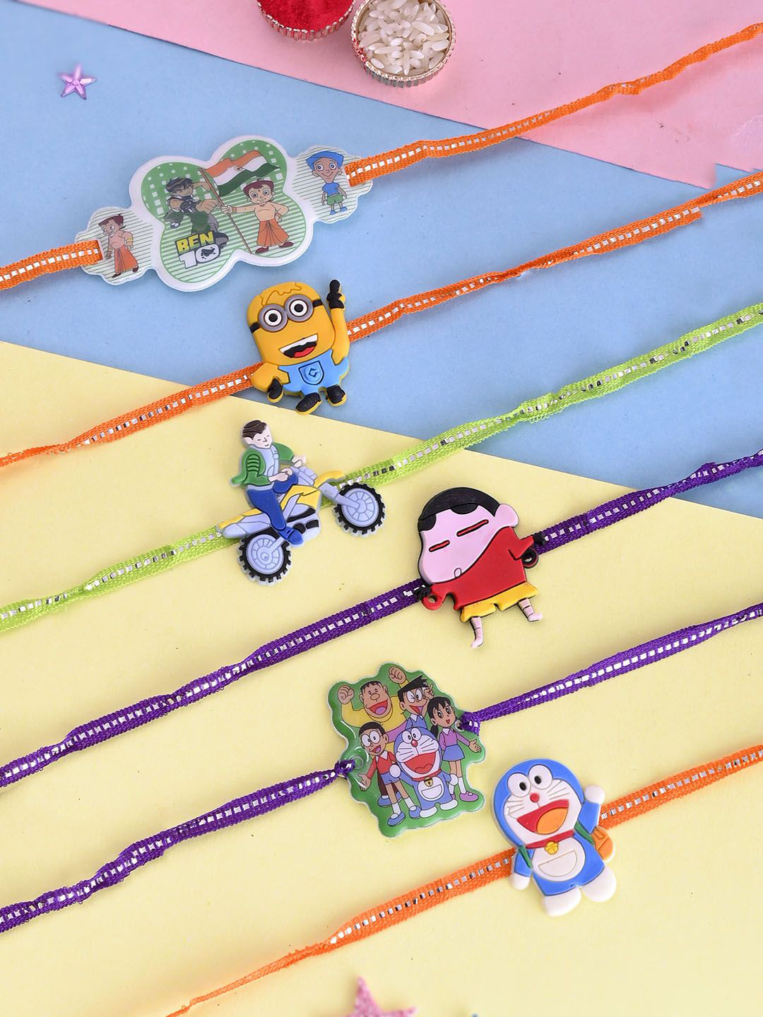 

Aapno Rajasthan Set Of 5 Cartoon Thread Rakhi With Roli Chawal & Greeting Card, Orange