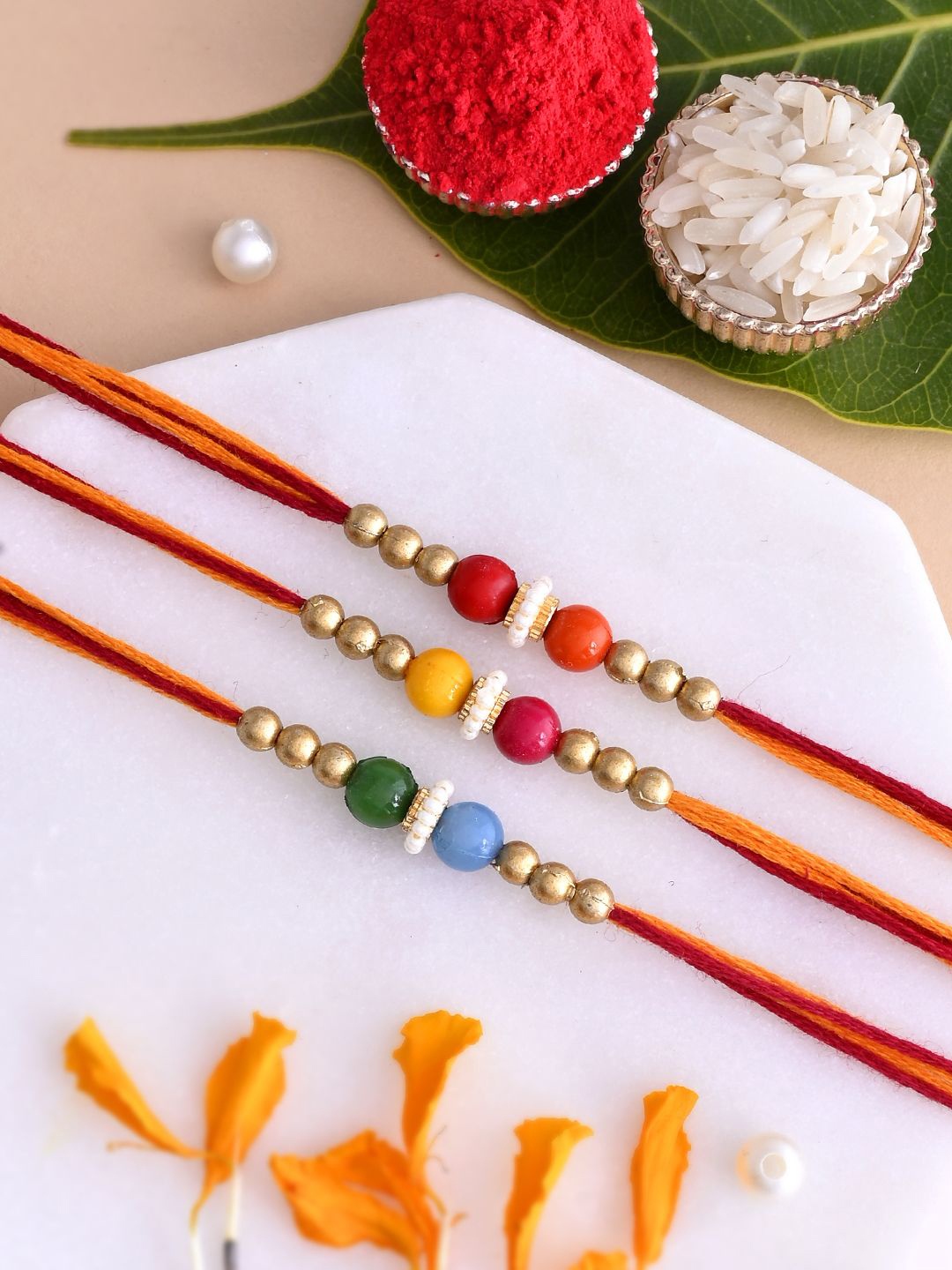 

Aapno Rajasthan Set of 3 Beaded Rakhi with Roli Chawal & Greeting Card, Gold