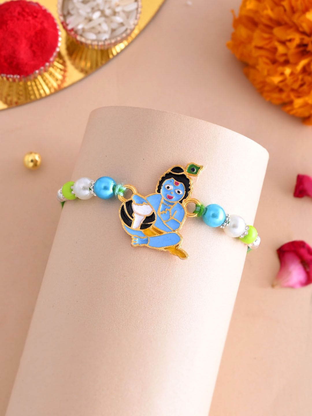 

Aapno Rajasthan Blue & Green Divine Krishna Rakhi With Roli Chawal