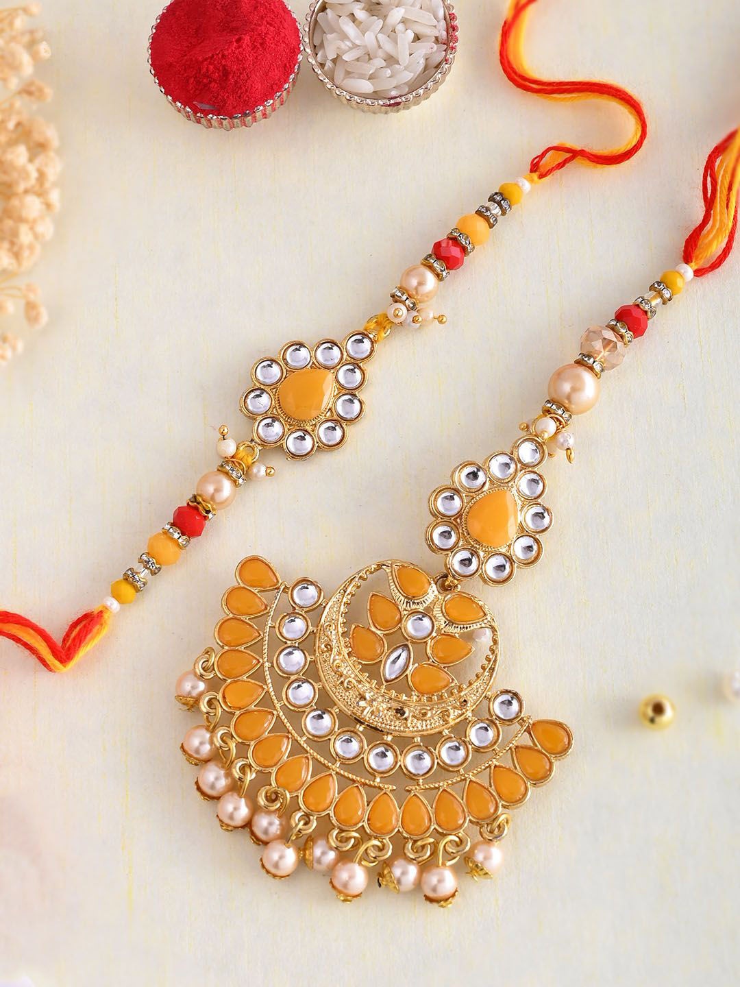 

Aapno Rajasthan Bhaiya Bhabhi Rakhi With Roli Chawal & Greeting Card, Gold