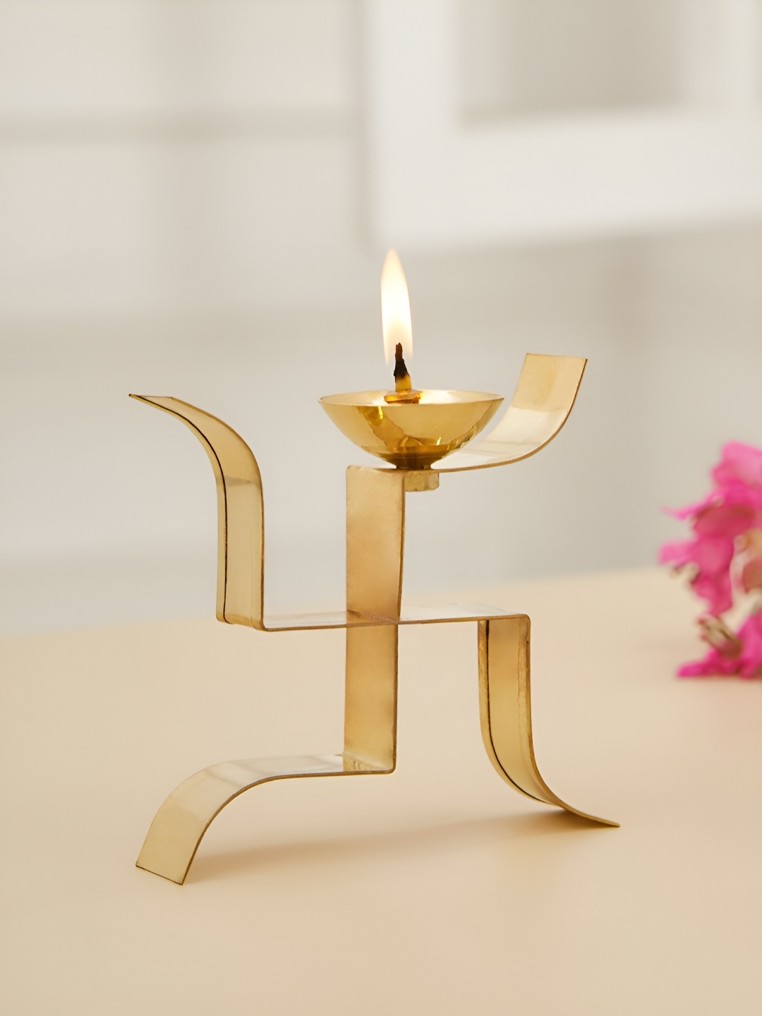 

DecorTwist Gold toned Brass Swastik Pooja Diya