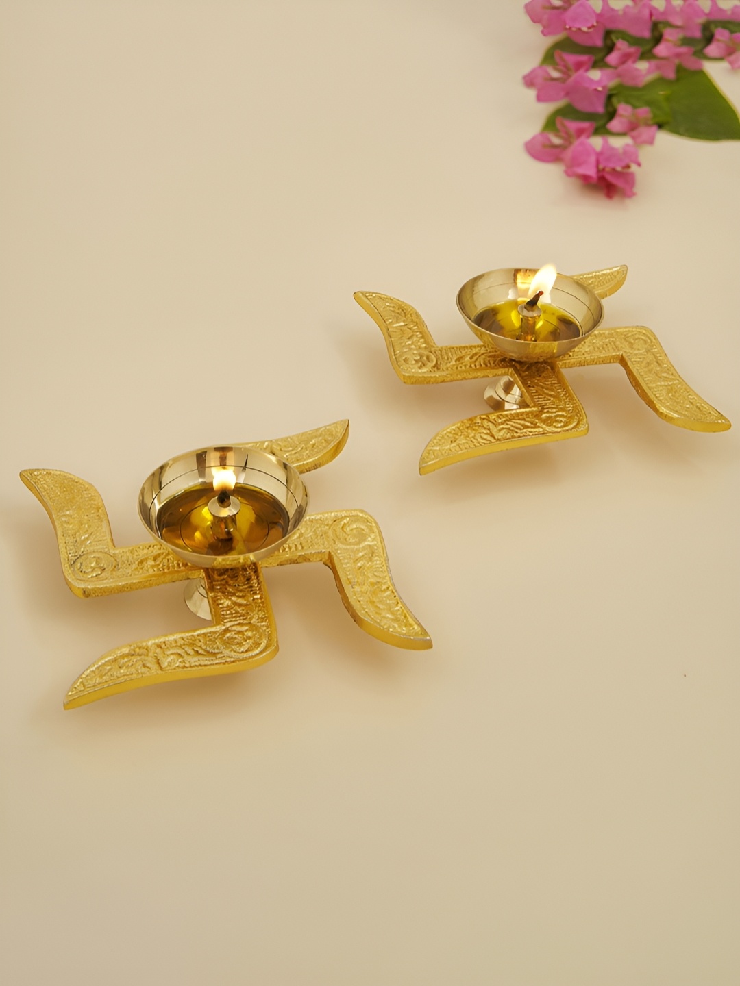 

DecorTwist Gold toned 2 Pieces Swastik Diya Pooja Essentials