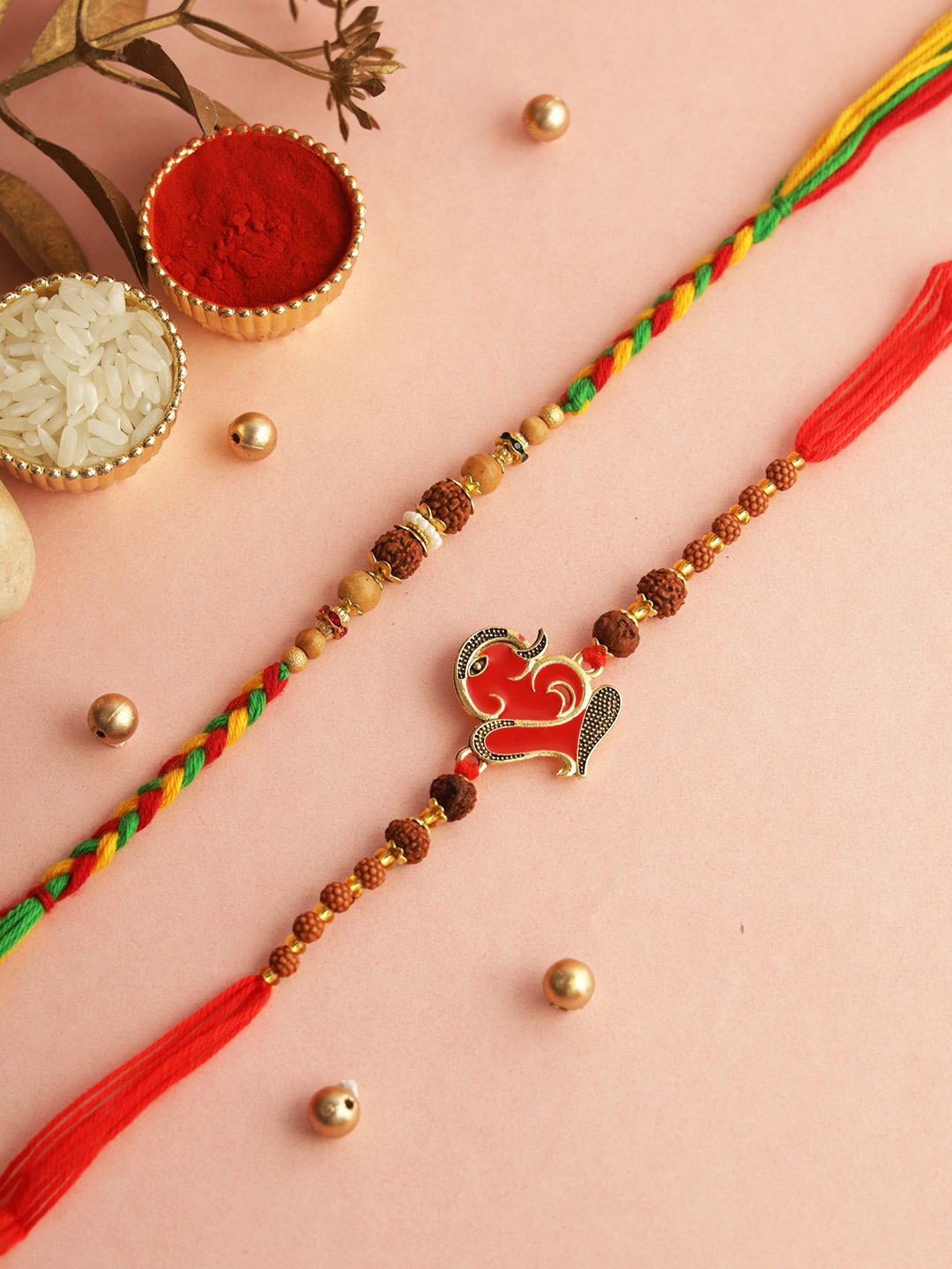 

Aapno Rajasthan Set Of 2 Stone Studded & Beaded Rakhis With Roli Chawal & Greetings Card, Red