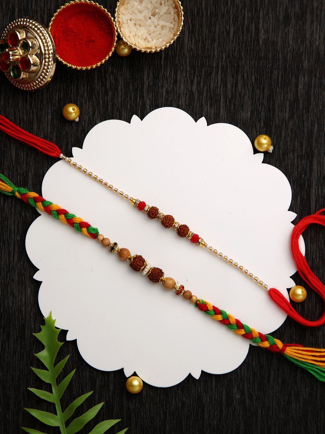 

Aapno Rajasthan Set of 2 Braided & Rudraksh Beaded Rakhi with Roli Chawal & Greeting Card, Brown
